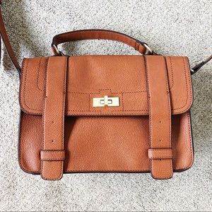 Leather hand bag with buckle and shoulder strap